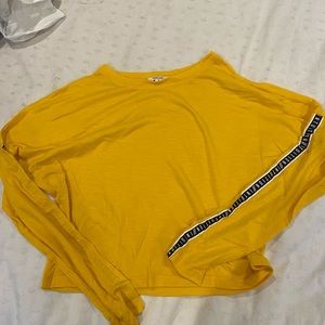 yellow ardent long sleeve with words on sleeves